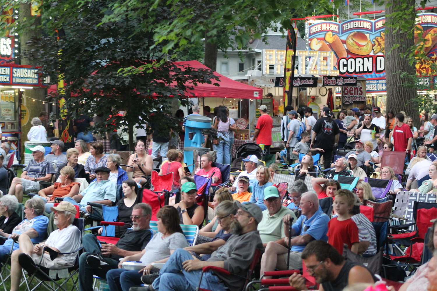 A large crowd gathers Saturday night on the historic grounds of the Lane Place in downtown Crawfordsville to take in the sights and sounds of the annual Strawberry Festival.
